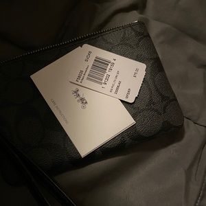 Brand new black coach leather wristlet